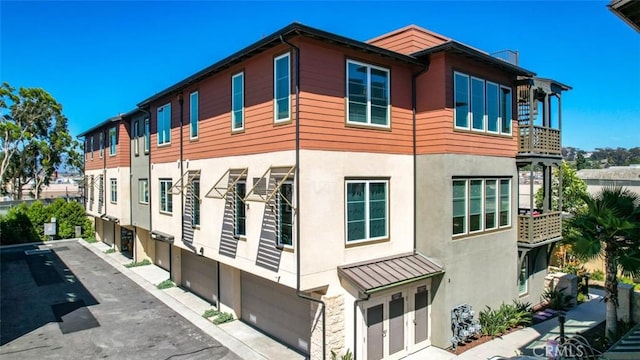 1207 Doheny Way, Dana Point, CA 92629 - view of property with an attached garage and driveway