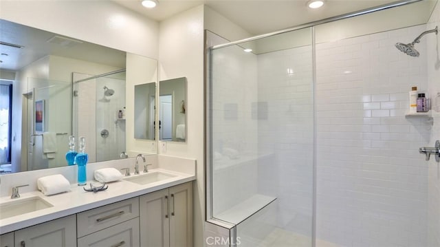 1207 Doheny Way, Dana Point, CA 92629 - bathroom with a stall shower, double vanity, and recessed lighting