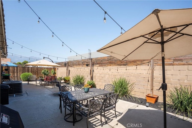 2355 S Pinehurst Pl, Ontario, CA 91761 - fenced backyard with a patio, outdoor dining area, and central air condition unit