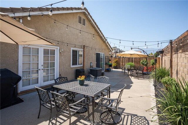 2355 S Pinehurst Pl, Ontario, CA 91761 - fenced backyard featuring a patio, outdoor dining area, central AC unit, and french doors