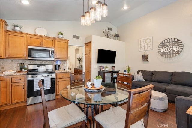 2355 S Pinehurst Pl, Ontario, CA 91761 - dining area featuring dark wood-style flooring and high vaulted ceiling