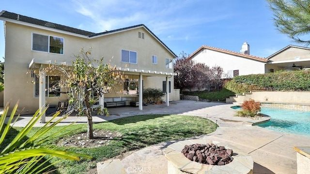 35430 Azalea Cir, Winchester, CA 92596 - rear view of house with a patio, an outdoor fire pit, stucco siding, an outdoor pool, and a chimney