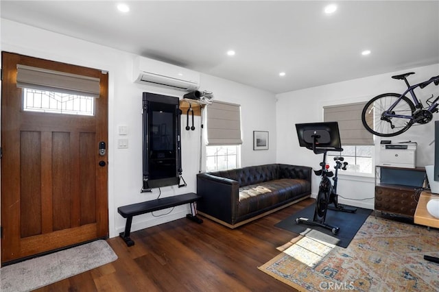 1856 W 43rd St, Los Angeles, CA 90062 - workout room featuring a wall mounted air conditioner, wood finished floors, recessed lighting, and baseboards