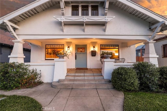 1856 W 43rd St, Los Angeles, CA 90062 - view of front of house with stucco siding and covered porch