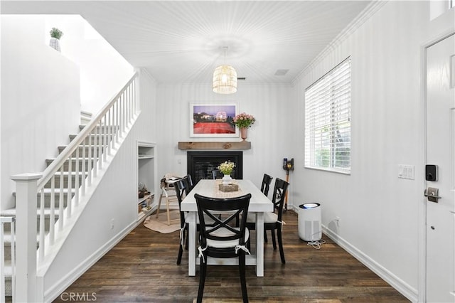 3 Bluff Cove Dr, Aliso Viejo, CA 92656 - dining area featuring stairway, dark wood-type flooring, a fireplace, baseboards, and crown molding