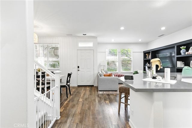 3 Bluff Cove Dr, Aliso Viejo, CA 92656 - kitchen with dark wood-style floors, a kitchen breakfast bar, recessed lighting, open floor plan, and a sink