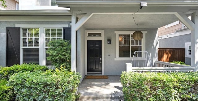 3 Bluff Cove Dr, Aliso Viejo, CA 92656 - doorway to property featuring stucco siding and a porch