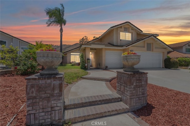 16783 Lake Knl, Riverside, CA 92503 - traditional-style home featuring concrete driveway, a garage, and stucco siding