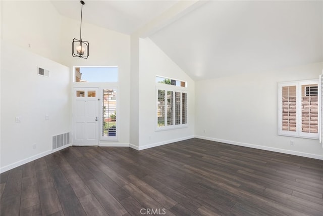 16783 Lake Knl, Riverside, CA 92503 - unfurnished living room with high vaulted ceiling, a chandelier, dark wood-style flooring, and baseboards