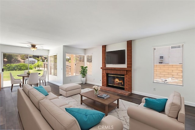 16783 Lake Knl, Riverside, CA 92503 - living room featuring dark wood finished floors, baseboards, a fireplace, and ceiling fan