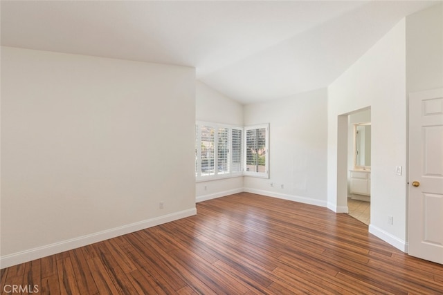 16783 Lake Knl, Riverside, CA 92503 - empty room with wood finished floors, vaulted ceiling, and baseboards