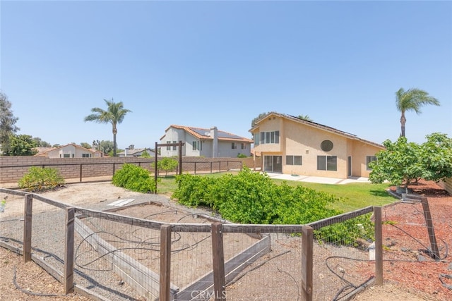 16783 Lake Knl, Riverside, CA 92503 - rear view of property with stucco siding, a fenced backyard, and a patio