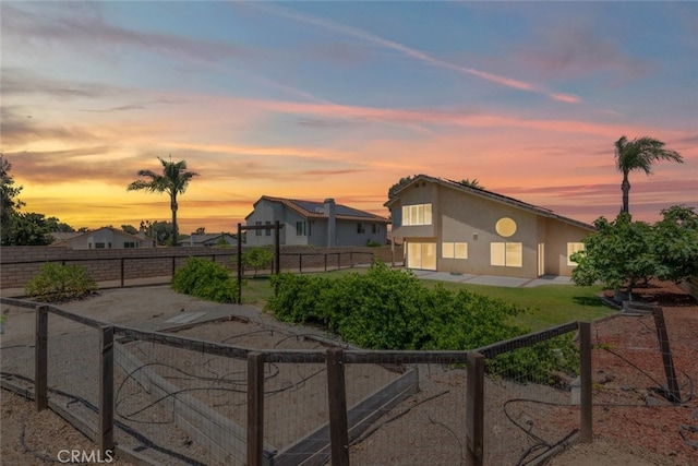 16783 Lake Knl, Riverside, CA 92503 - view of front facade featuring stucco siding, a fenced backyard, and a patio
