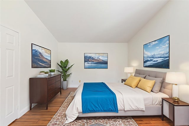 16783 Lake Knl, Riverside, CA 92503 - bedroom featuring wood finished floors, lofted ceiling, and baseboards