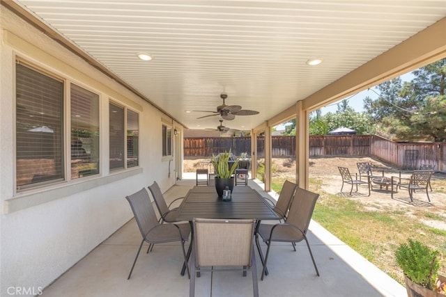 36867 Gallery Ln, Beaumont, CA 92223 - fenced backyard with a patio area, outdoor dining space, ceiling fan, and an outdoor fire pit