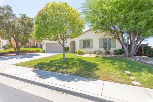36867 Gallery Ln, Beaumont, CA 92223 - view of front facade with driveway, an attached garage, stucco siding, and a front lawn