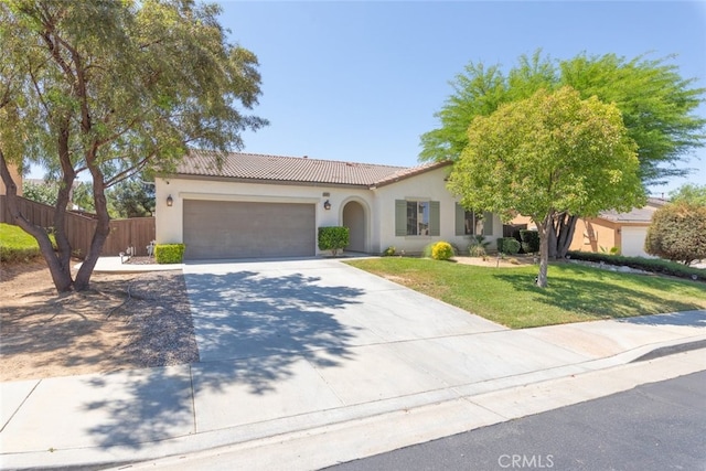 36867 Gallery Ln, Beaumont, CA 92223 - mediterranean / spanish-style home with stucco siding, concrete driveway, an attached garage, and a tile roof
