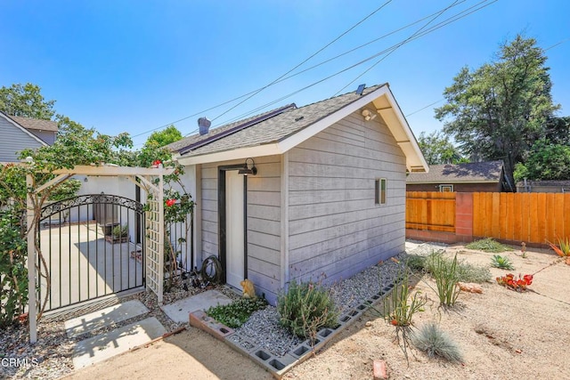 829 E Ada Ave, Glendora, CA 91741 - view of home's exterior featuring a gate, an outdoor structure, and a shingled roof