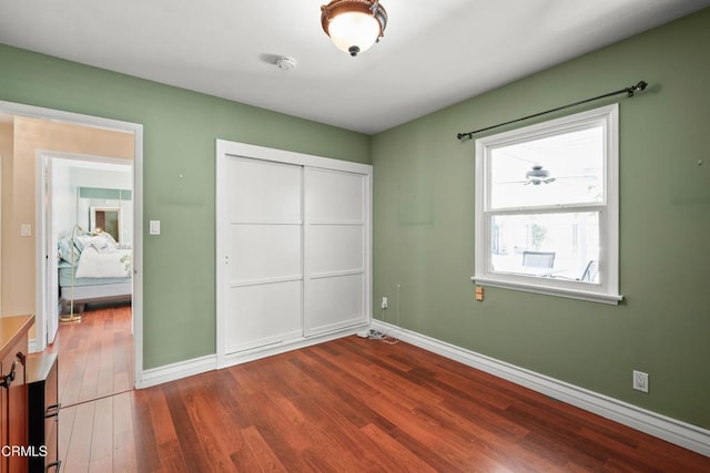 829 E Ada Ave, Glendora, CA 91741 - unfurnished bedroom with dark wood-style flooring, baseboards, and a closet