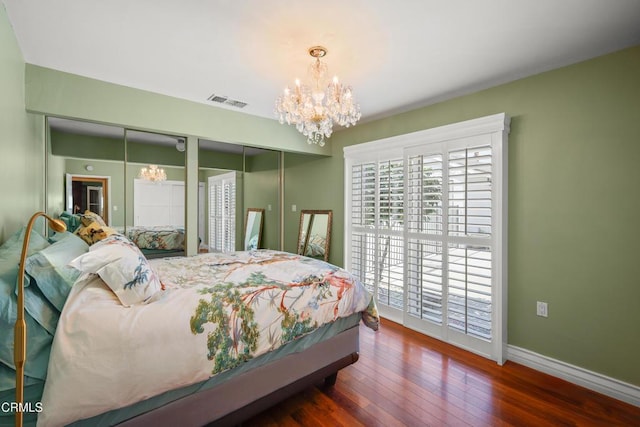 829 E Ada Ave, Glendora, CA 91741 - bedroom with a chandelier, hardwood / wood-style floors, baseboards, and multiple closets