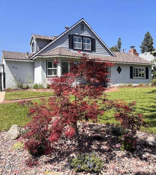 829 E Ada Ave, Glendora, CA 91741 - view of front facade featuring stucco siding, a front yard, and a chimney