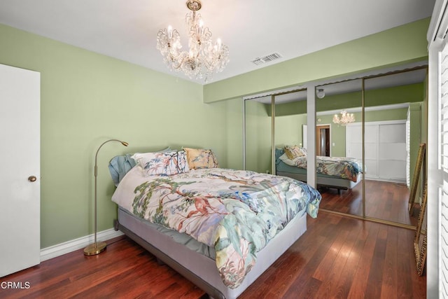 829 E Ada Ave, Glendora, CA 91741 - bedroom featuring a chandelier, two closets, wood-type flooring, and baseboards
