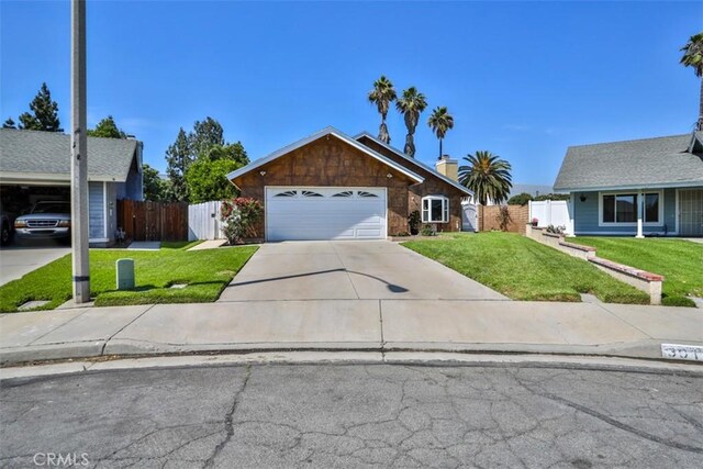 3012 Homer Cir, Jurupa Valley, CA 91752 - view of front of house with an attached garage, concrete driveway, and a gate