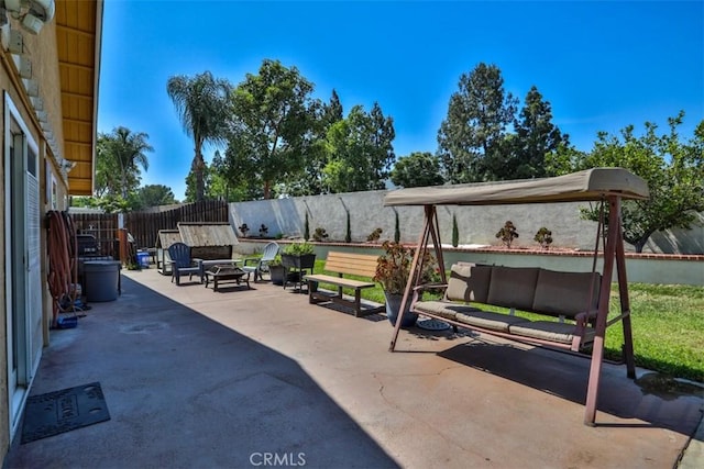 3012 Homer Cir, Jurupa Valley, CA 91752 - fenced backyard with an outdoor living space with a fire pit and a patio