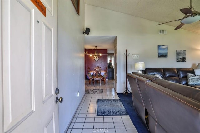 3012 Homer Cir, Jurupa Valley, CA 91752 - tiled living area featuring ceiling fan, a chandelier, lofted ceiling, and a textured ceiling