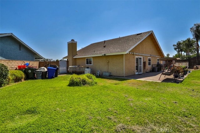3012 Homer Cir, Jurupa Valley, CA 91752 - rear view of house featuring a patio, stucco siding, and a chimney