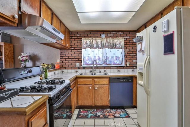 3012 Homer Cir, Jurupa Valley, CA 91752 - kitchen with white fridge with ice dispenser, dishwashing machine, range with gas cooktop, tile countertops, and island exhaust hood