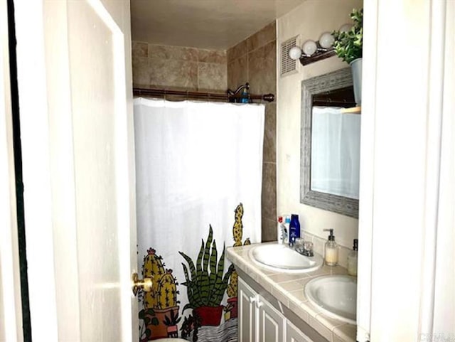 2840 Ridgeway Dr, National City, CA 91950 - full bathroom featuring double vanity and curtained shower