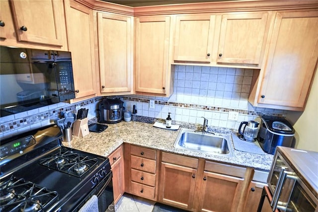 911 Genoa St, Monrovia, CA 91016 - kitchen with black appliances, a sink, backsplash, and light stone counters
