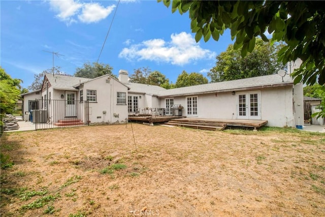4622 Burnet Ave, Sherman Oaks, CA 91403 - back of property with french doors, a deck, stucco siding, a chimney, and a yard