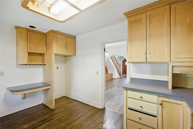 915 Poplar St, Chico, CA 95928 - kitchen featuring dark wood-type flooring, baseboards, and arched walkways