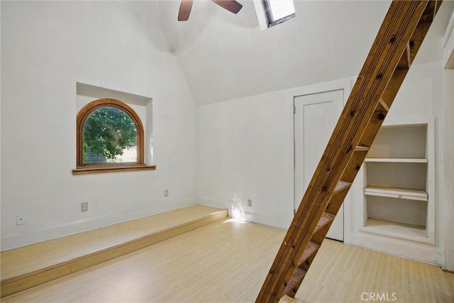 915 Poplar St, Chico, CA 95928 - additional living space with wood finished floors, vaulted ceiling, a ceiling fan, and a skylight