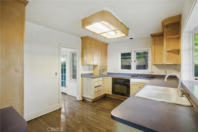 915 Poplar St, Chico, CA 95928 - kitchen featuring oven, stainless steel gas cooktop, dark wood-style floors, and light brown cabinets