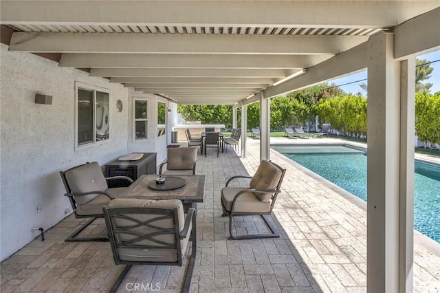2230 N Volturno Rd, Palm Springs, CA 92262 - view of patio / terrace featuring outdoor dining space and an outdoor pool