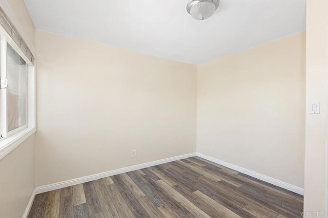 575 7th St # 203, Imperial Beach, CA 91932 - spare room featuring dark wood-style floors and baseboards