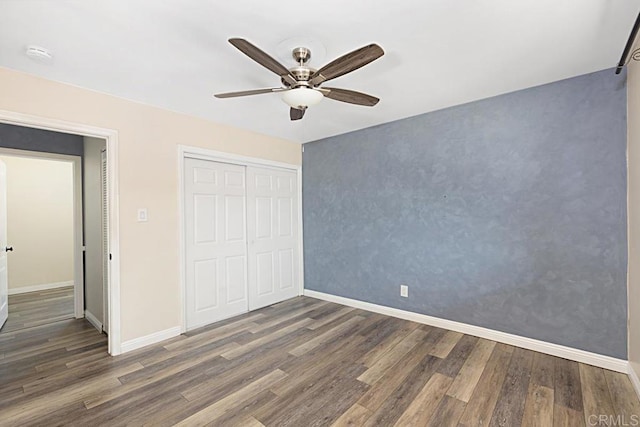 575 7th St # 203, Imperial Beach, CA 91932 - unfurnished bedroom with wood finished floors, baseboards, a closet, and a ceiling fan
