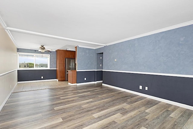 575 7th St # 203, Imperial Beach, CA 91932 - spare room featuring wood finished floors, a ceiling fan, ornamental molding, and baseboards