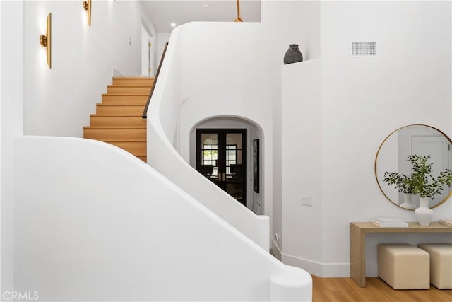 2317 Via Zafiro, San Clemente, CA 92673 - stairway featuring wood finished floors, a high ceiling, and baseboards