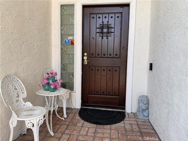 8730 Twin Trails Dr, San Diego, CA 92129 - doorway to property featuring stucco siding