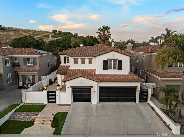 38 Via Sonrisa, San Clemente, CA 92673 - mediterranean / spanish home with a tile roof, stucco siding, a garage, concrete driveway, and a chimney