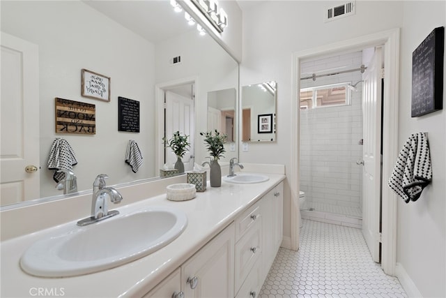 38 Via Sonrisa, San Clemente, CA 92673 - bathroom featuring toilet, double vanity, a shower stall, and baseboards