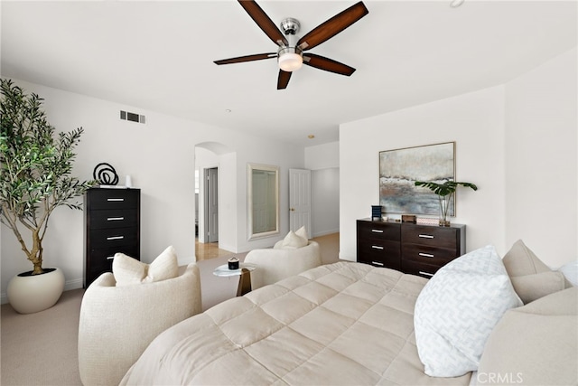38 Via Sonrisa, San Clemente, CA 92673 - bedroom with arched walkways, a ceiling fan, light colored carpet, and baseboards