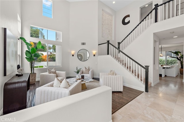 38 Via Sonrisa, San Clemente, CA 92673 - living area featuring a towering ceiling, stairway, baseboards, and recessed lighting
