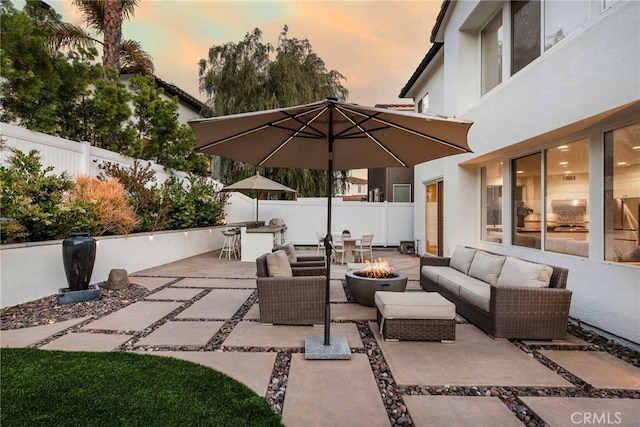 38 Via Sonrisa, San Clemente, CA 92673 - patio terrace at dusk featuring an outdoor living space with a fire pit, a patio, and a fenced backyard