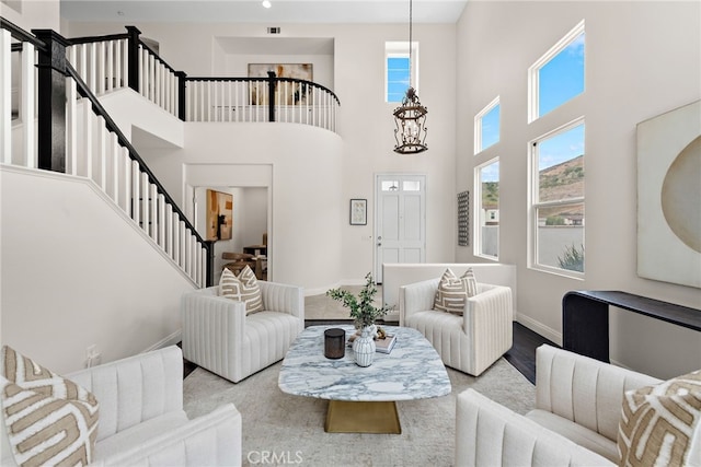38 Via Sonrisa, San Clemente, CA 92673 - living area with stairs, baseboards, healthy amount of natural light, a high ceiling, and a chandelier