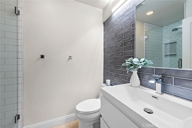 38 Via Sonrisa, San Clemente, CA 92673 - full bathroom featuring vanity, toilet, a tile shower, and baseboards